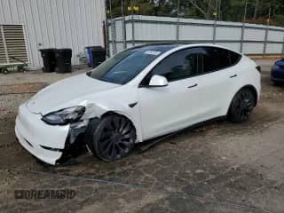 2023 Tesla Model Y Performance with VIN 7SAYGDEF1PF705018, listed as a Copart auction lot 82044395 with 21,220 mi miles and Salvage title. Bid and sale history available at DreamBid. Image 1.