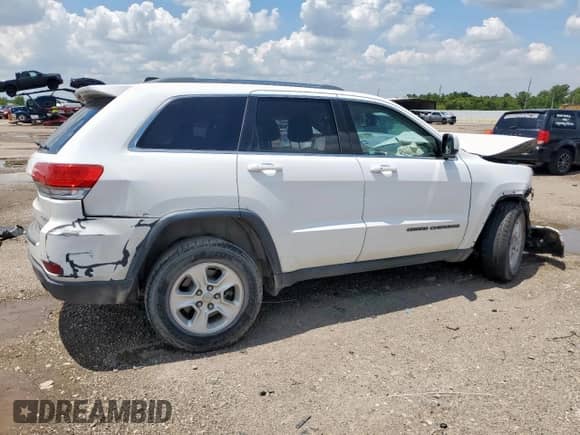 2017 Jeep Grand Cherokee Laredo with VIN 1C4RJEAG2HC614572, listed as a Copart auction lot 67870085 with 123,868 mi miles and Salvage title. Bid and sale history available at DreamBid. Image 3.