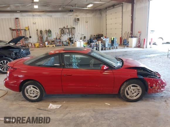 1997 Saturn 2dr Coupe with VIN 1G8ZH1277VZ110038, listed as a IAAI auction lot 42546514 with 83,164 mi miles and . Bid and sale history available at DreamBid. Image 13.