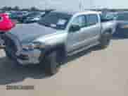 2021 Toyota Tacoma SR with VIN 5TFCZ5ANXMX268304, listed as a IAAI auction lot 43066752 with 66,578 mi miles and . Bid and sale history available at DreamBid. Image 2.