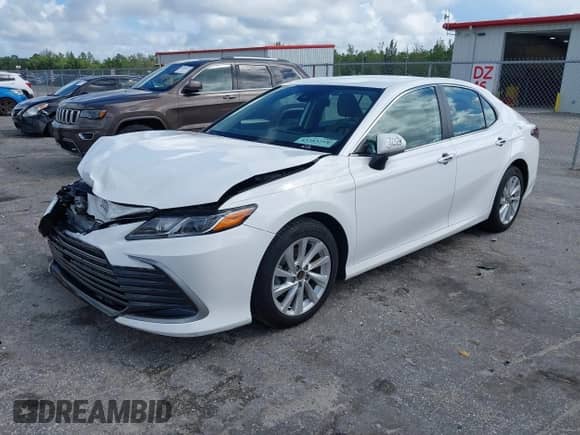 2021 Toyota Camry LE with VIN 4T1C11AK8MU601313, listed as a IAAI auction lot 43383218 with 34,384 mi miles and . Bid and sale history available at DreamBid. Image 2.