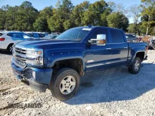 2016 Chevrolet Silverado 1500 High Country with VIN 3GCUKTEJ3GG136059, listed as a Copart auction lot 87051384 with 121,935 mi miles and Salvage title. Bid and sale history available at DreamBid. Image 1.