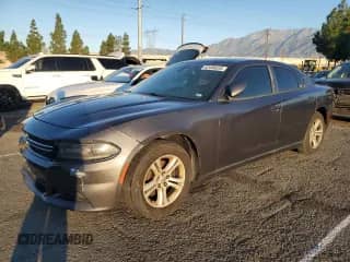 2015 Dodge Charger SE with VIN 2C3CDXBG8FH745401, listed as a Copart auction lot 82486635 with 177,969 mi miles and Clean title. Bid and sale history available at DreamBid. Image 1.
