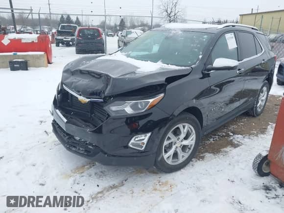 2021 Chevrolet Equinox Premier with VIN 2GNAXNEV9M6150369, listed as a IAAI auction lot 41315549 with 57,614 mi miles and . Bid and sale history available at DreamBid. Image 2.