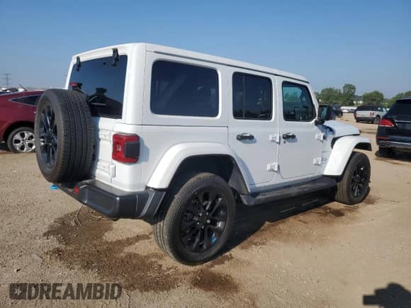 2023 Jeep Wrangler Sahara with VIN 1C4JJXP69PW556187, listed as a Copart auction lot 67539065 with 54,671 mi miles and Salvage title. Bid and sale history available at DreamBid. Image 3.