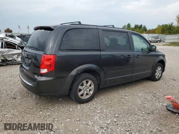 2012 Dodge Grand Caravan American Value z VIN 2C4RDGBG7CR148235, wystawiony jako Copart lot #81545825 z przebiegiem 167 455 mil mil oraz Czysty tytuł • Clean title. Historia ofert i sprzedaży dostępna na DreamBid. Obrazek 3.