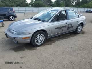 1999 Saturn SL with VIN 1G8ZK5277XZ306928, listed as a Copart auction lot 63299615 with 42,474 mi miles and Salvage title. Bid and sale history available at DreamBid. Image 1.