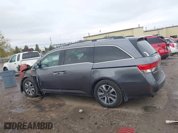 2016 Honda Odyssey Touring Elite z VIN 5FNRL5H92GB052661, wystawiony jako IAAI lot #43451962 z przebiegiem 145 569 mil mil oraz . Historia ofert i sprzedaży dostępna na DreamBid. Obrazek 14.