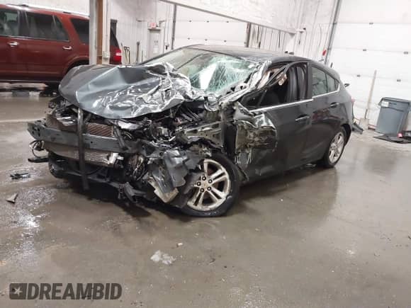 2018 Chevrolet Cruze LT z VIN 3G1BH6SE9JS655290, wystawiony jako IAAI lot #41538717 z przebiegiem Nie podano mil oraz . Historia ofert i sprzedaży dostępna na DreamBid. Obrazek 17.