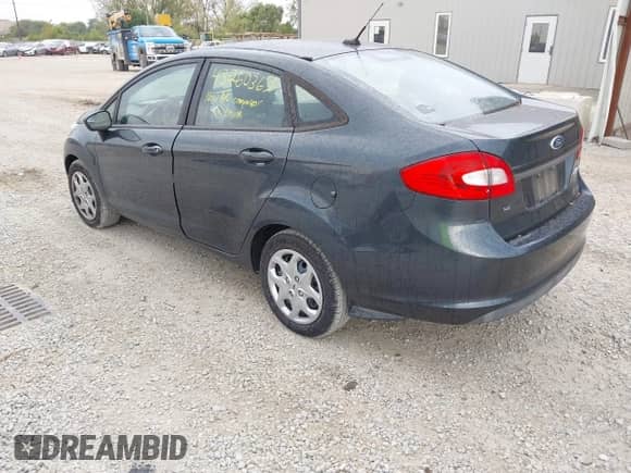 2011 Ford Fiesta SE z VIN 3FADP4BJ6BM165924, wystawiony jako IAAI lot #43260367 z przebiegiem 165 752 mil mil oraz . Historia ofert i sprzedaży dostępna na DreamBid. Obrazek 3.