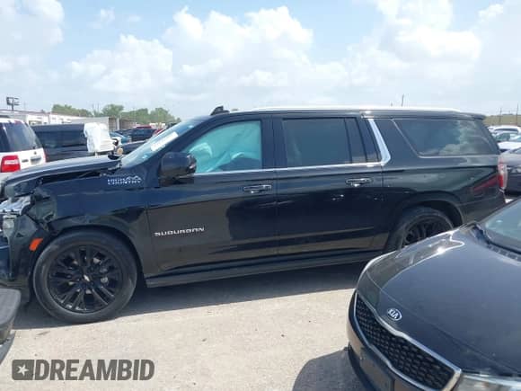 2021 Chevrolet Suburban High Country z VIN 1GNSCGKL0MR206783, wystawiony jako IAAI lot #42540867 z przebiegiem 91 911 mil mil oraz . Historia ofert i sprzedaży dostępna na DreamBid. Obrazek 14.