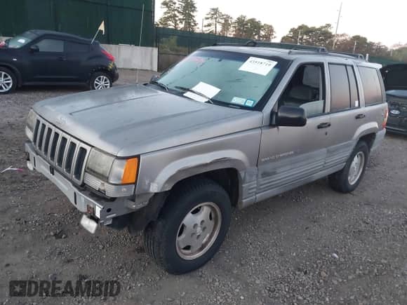 1997 Jeep Grand Cherokee Laredo with VIN 1J4GZ58YXVC765227, listed as a IAAI auction lot 43518719 with 97,000 mi miles and . Bid and sale history available at DreamBid. Image 2.