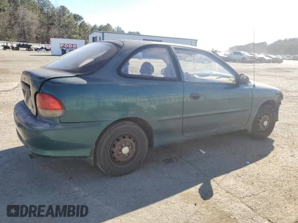 1999 Hyundai Accent L z VIN KMHVD14N4XU456698, wystawiony jako Copart lot #41733345 z przebiegiem 197 574 mil mil oraz Szkoda całkowita • Salvage title. Historia ofert i sprzedaży dostępna na DreamBid. Obrazek 3.