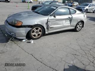 2003 Hyundai Tiburon GT с VIN KMHHN65F03U055237, выставлен на аукционе Copart как лот 82400615 с пробегом 244 468 миль миль и Списание • Salvage title. История ставок и продаж доступна на DreamBid. Изображение 1.