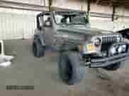 2004 Jeep Wrangler Sport z VIN 1J4FA49S14P768676, wystawiony jako Copart lot #69976745 z przebiegiem 165 894 mil mil oraz Szkoda całkowita • Salvage title. Historia ofert i sprzedaży dostępna na DreamBid. Obrazek 15.