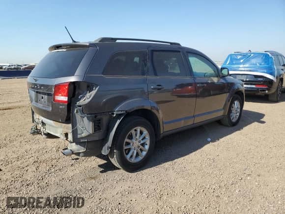 2017 Dodge Journey SXT with VIN 3C4PDDBG2HT505587, listed as a Copart auction lot 68467125 with 100,566 mi miles and Salvage title. Bid and sale history available at DreamBid. Image 3.