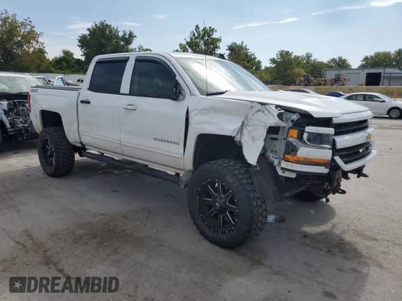 2018 Chevrolet Silverado 1500 LT z VIN 3GCUKREC7JG484152, wystawiony jako Copart lot #71714215 z przebiegiem 158 596 mil mil oraz Szkoda całkowita • Salvage title. Historia ofert i sprzedaży dostępna na DreamBid. Obrazek 4.