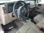 2004 Jeep Wrangler Sahara с VIN 1J4FA59S84P801582, выставлен на аукционе Copart как лот 64183535 с пробегом 127 213 миль миль и Списание • Salvage title. История ставок и продаж доступна на DreamBid. Изображение 8.