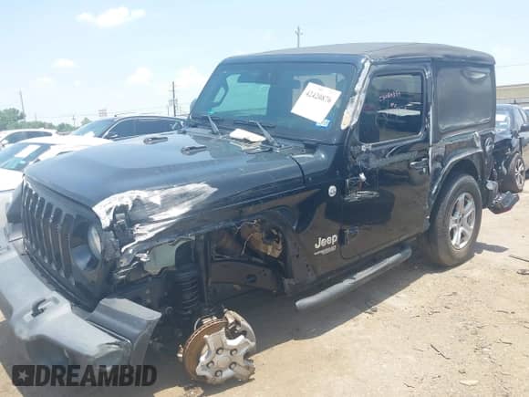 2019 Jeep Wrangler Sport S with VIN 1C4GJXAG0KW679915, listed as a IAAI auction lot 42420876 with 77,169 mi miles and . Bid and sale history available at DreamBid. Image 17.