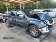 2013 Nissan Frontier SL with VIN 1N6AD0ER2DN712919, listed as a Copart auction lot 62019235 with 242,539 mi miles and Salvage title. Bid and sale history available at DreamBid. Image 4.