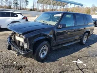2000 Chevrolet Tahoe Limited с VIN 1GNEC13R5YR162203, выставлен на аукционе Copart как лот 83199854 с пробегом 347 572 миль миль и Списание • Salvage title. История ставок и продаж доступна на DreamBid. Изображение 1.