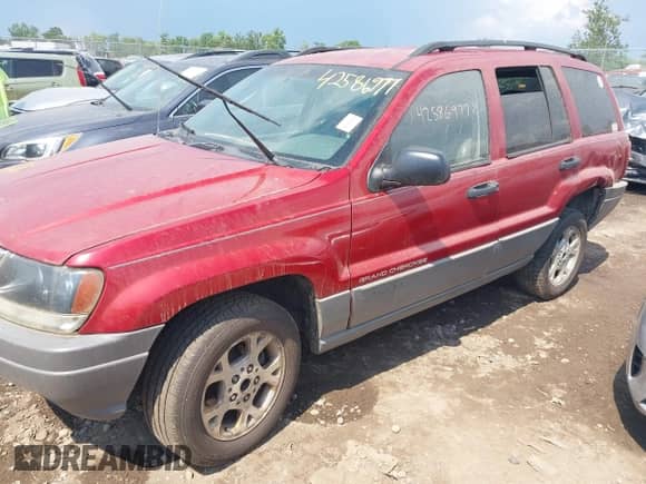 2002 Jeep Grand Cherokee Sport with VIN 1J4GW38S72C276689, listed as a IAAI auction lot 42586977 with 360,258 mi miles and . Bid and sale history available at DreamBid. Image 2.