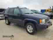 1998 Jeep Grand Cherokee with VIN 1J4FX48S1WC244308, listed as a Copart auction lot 74384714 with Not provided miles and Non repairable. Bid and sale history available at DreamBid. Image 4.