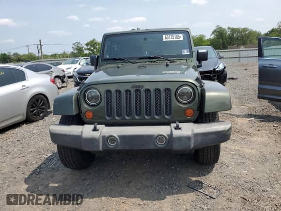 2007 Jeep Wrangler Sahara z VIN 1J8FA54137L145641, wystawiony jako Copart lot #60125185 z przebiegiem 160 119 mil mil oraz Szkoda całkowita • Salvage title. Historia ofert i sprzedaży dostępna na DreamBid. Obrazek 5.