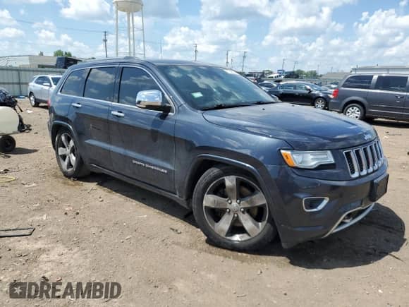 2015 Jeep Grand Cherokee Overland with VIN 1C4RJFCT1FC638648, listed as a Copart auction lot 61739035 with 110,519 mi miles and Salvage title. Bid and sale history available at DreamBid. Image 4.