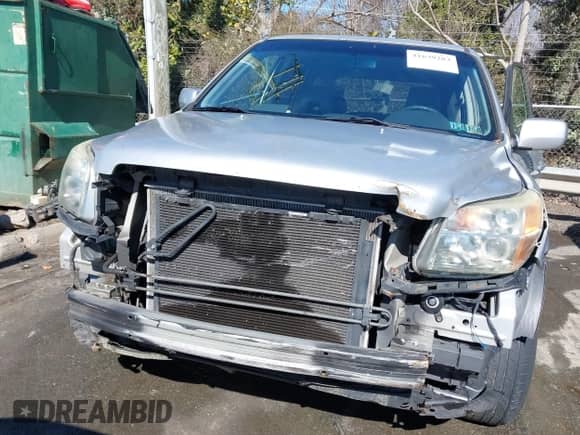 2006 Honda Pilot EX-L with VIN 5FNYF18726B024951, listed as a IAAI auction lot 41639283 with 370,476 mi miles and . Bid and sale history available at DreamBid. Image 6.