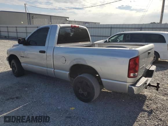 2003 Dodge 1500 ST with VIN 1D7HA16K23J602093, listed as a Copart auction lot 81409815 with 148,065 mi miles and Salvage title. Bid and sale history available at DreamBid. Image 2.