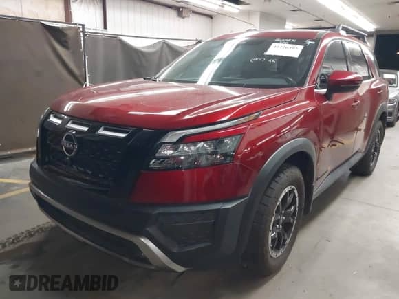 2023 Nissan Pathfinder Rock Creek with VIN 5N1DR3BD7PC276625, listed as a IAAI auction lot 42226402 with 11,872 mi miles and . Bid and sale history available at DreamBid. Image 2.