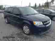 2014 Dodge Grand Caravan SE with VIN 2C4RDGBG0ER187249, listed as a IAAI auction lot 42143078 with 119,097 mi miles and . Bid and sale history available at DreamBid. Image 1.