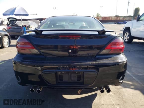 2002 Pontiac Grand Am GT z VIN 1G2NW52E12M704539, wystawiony jako Copart lot #73755214 z przebiegiem 100 904 mil mil oraz Czysty tytuł • Clean title. Historia ofert i sprzedaży dostępna na DreamBid. Obrazek 6.