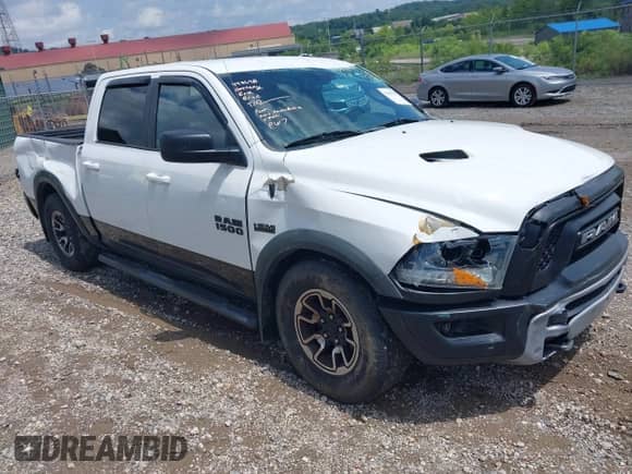 2015 Ram 1500 Rebel with VIN 1C6RR7YT0FS751169, listed as a IAAI auction lot 42689218 with 101,431 mi miles and . Bid and sale history available at DreamBid. Image 1.