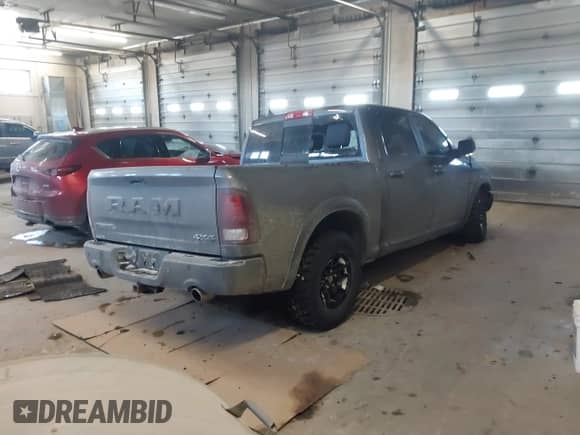2018 Ram 1500 Rebel with VIN 1C6RR7YT1JS234777, listed as a IAAI auction lot 41409525 with 119,497 mi miles and . Bid and sale history available at DreamBid. Image 4.