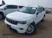 2020 Jeep Grand Cherokee Laredo E with VIN 1C4RJEAG4LC245884, listed as a IAAI auction lot 42564754 with 63,356 mi miles and . Bid and sale history available at DreamBid. Image 2.