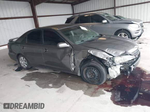 2004 Toyota Camry LE with VIN 4T1BE32KX4U919993, listed as a IAAI auction lot 42337318 with 182,660 mi miles and . Bid and sale history available at DreamBid. Image 13.