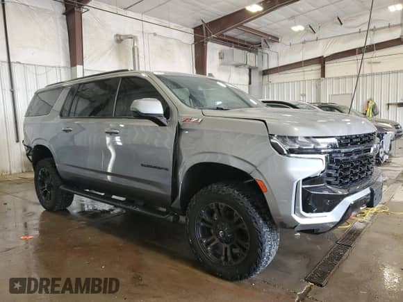 2023 Chevrolet Suburban Z71 with VIN 1GNSKDKD7PR219240, listed as a Copart auction lot 67590975 with 48,749 mi miles and Salvage title. Bid and sale history available at DreamBid. Image 4.