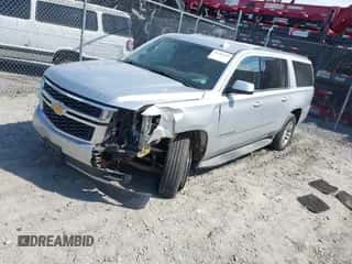 2015 Chevrolet Suburban LT z VIN 1GNSCJKC1FR547805, wystawiony jako IAAI lot #43186369 z przebiegiem 277 934 mil mil oraz . Historia ofert i sprzedaży dostępna na DreamBid. Obrazek 2.