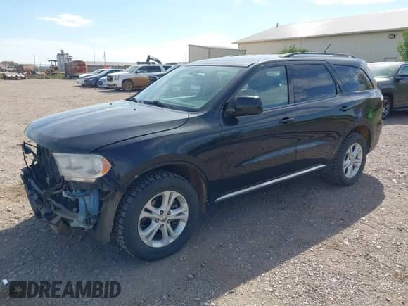 2013 Dodge Durango SXT with VIN 1C4RDJAG4DC576806, listed as a IAAI auction lot 43175682 with 207,340 mi miles and . Bid and sale history available at DreamBid. Image 2.