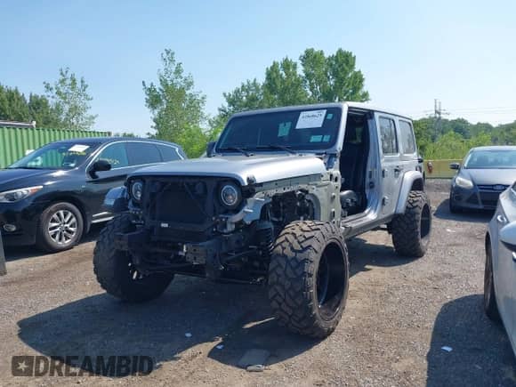 2021 Jeep Wrangler Unlimited Sahara High Altitude with VIN 1C4HJXENXMW670526, listed as a IAAI auction lot 42868629 with 26,407 mi miles and . Bid and sale history available at DreamBid. Image 6.