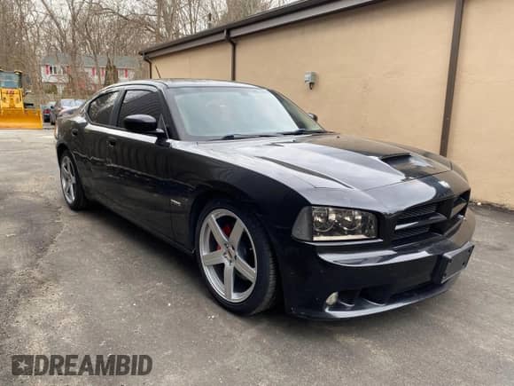 2008 Dodge Charger SRT-8 с VIN 2B3LA73W08H150301, выставлен на аукционе Copart как лот 75657624 с пробегом 152 591 миль миль и Чистый • Clean title. История ставок и продаж доступна на DreamBid. Изображение 1.