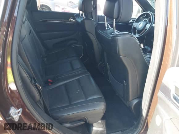 2014 Jeep Grand Cherokee Summit z VIN 1C4RJFJM2EC534132, wystawiony jako IAAI lot #42842349 z przebiegiem 96 636 mil mil oraz . Historia ofert i sprzedaży dostępna na DreamBid. Obrazek 8.