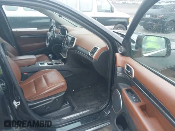 2015 Jeep Grand Cherokee Summit z VIN 1C4RJFJM7FC236998, wystawiony jako IAAI lot #43391148 z przebiegiem 173 967 mil mil oraz . Historia ofert i sprzedaży dostępna na DreamBid. Obrazek 5.