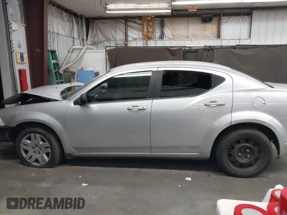 2012 Dodge Avenger SE z VIN 1C3CDZAB3CN211954, wystawiony jako IAAI lot #43264062 z przebiegiem 103 954 mil mil oraz . Historia ofert i sprzedaży dostępna na DreamBid. Obrazek 13.