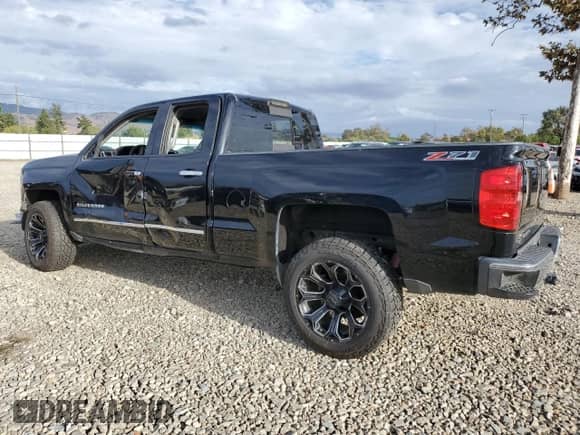 2014 Chevrolet Silverado 1500 LTZ with VIN 1GCVKSEC8EZ286746, listed as a Copart auction lot 82233735 with 184,152 mi miles and Salvage title. Bid and sale history available at DreamBid. Image 2.