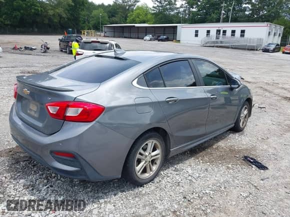 2018 Chevrolet Cruze LT with VIN 1G1BE5SM6J7198916, listed as a IAAI auction lot 42502138 with 179,272 mi miles and . Bid and sale history available at DreamBid. Image 4.