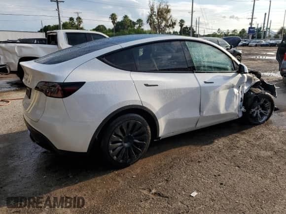 2023 Tesla Model Y Long Range with VIN 7SAYGAEE4PF863973, listed as a Copart auction lot 67838404 with 25,165 mi miles and Salvage title. Bid and sale history available at DreamBid. Image 3.