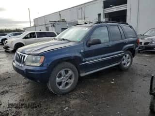 2004 Jeep Grand Cherokee Overland с VIN 1J8GW68JX4C264949, выставлен на аукционе Copart как лот 82306755 с пробегом 258 711 миль миль и Списание • Salvage title. История ставок и продаж доступна на DreamBid. Изображение 1.